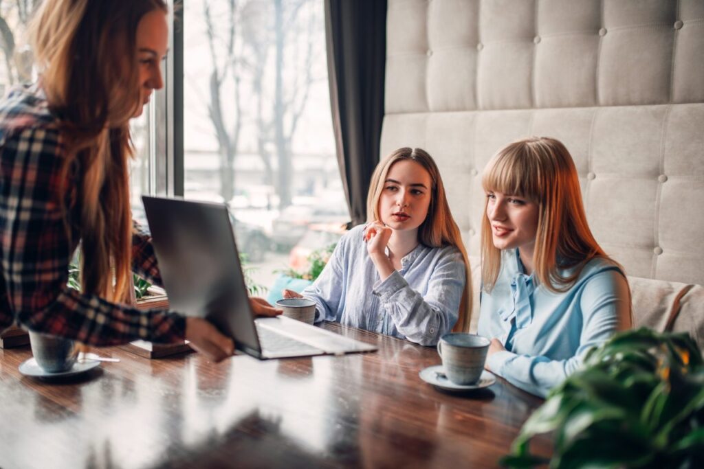 business presentation on laptop in cafe marketing